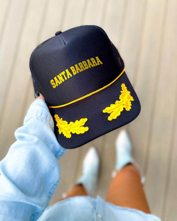Santa Barbara California black trucker hat with gold varsity lettering, gold rope and gold oak leaves on the visor