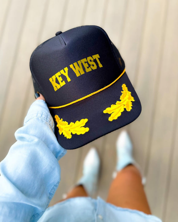 Key West Florida black trucker hat with gold varsity lettering, gold rope and gold oak leaves on the visor