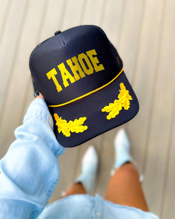 Lake Tahoe California black trucker hat with gold varsity lettering, gold rope and gold oak leaves on the visor